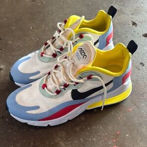 Nike women’s 9 White, Blue, Red, and Yellow Sneakers